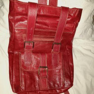 Large red leather backpack.